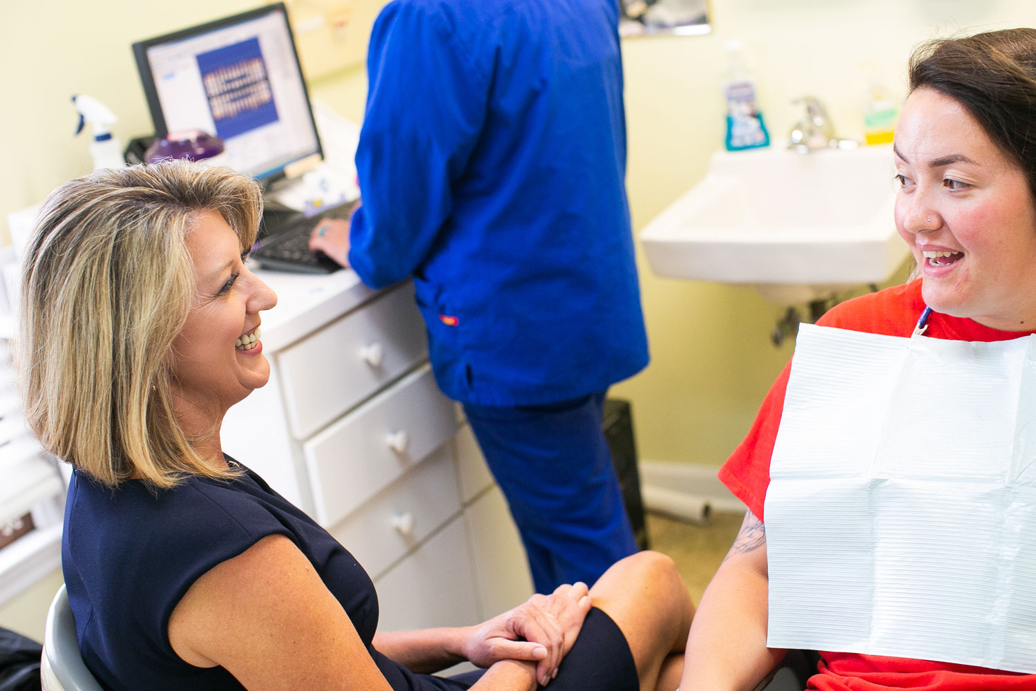 Dr. Collins and Hometown Dental Richmond staff working together Dr. Collins and Hometown Dental Richmond staff working together